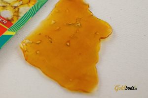 close up picture of a large piece of shatter marijuana concentrate